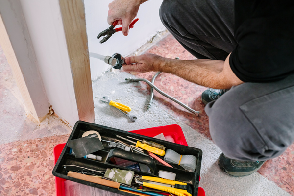 plumber doing heating installation construction site